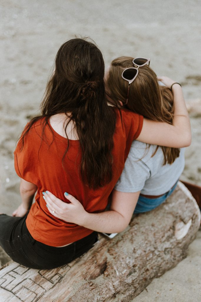 Two girls embracing for GTM Friends Mental Health