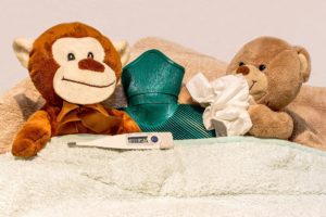 Two teddies sick in bed for How the HPV Vaccine Helps to Prevent Cancer article