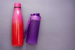 Reusable water bottles over grey background, drinking water for Reduce Single Use Plastic article