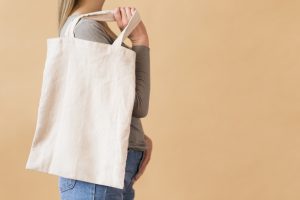 Cloth shopping bag slung over shoulder for Reduce Single Use Plastic article