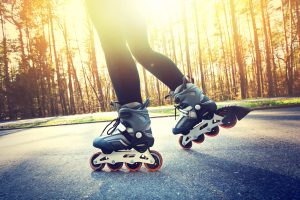 Teenage girl on roller skates at summer. For unhealthy during lockdown article