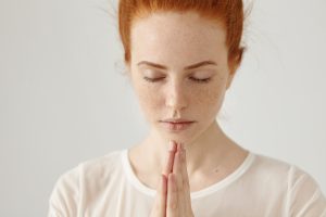 A-Level results Young woman in white blouse meditating