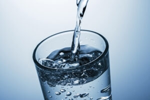 Water being poured into a clear glass