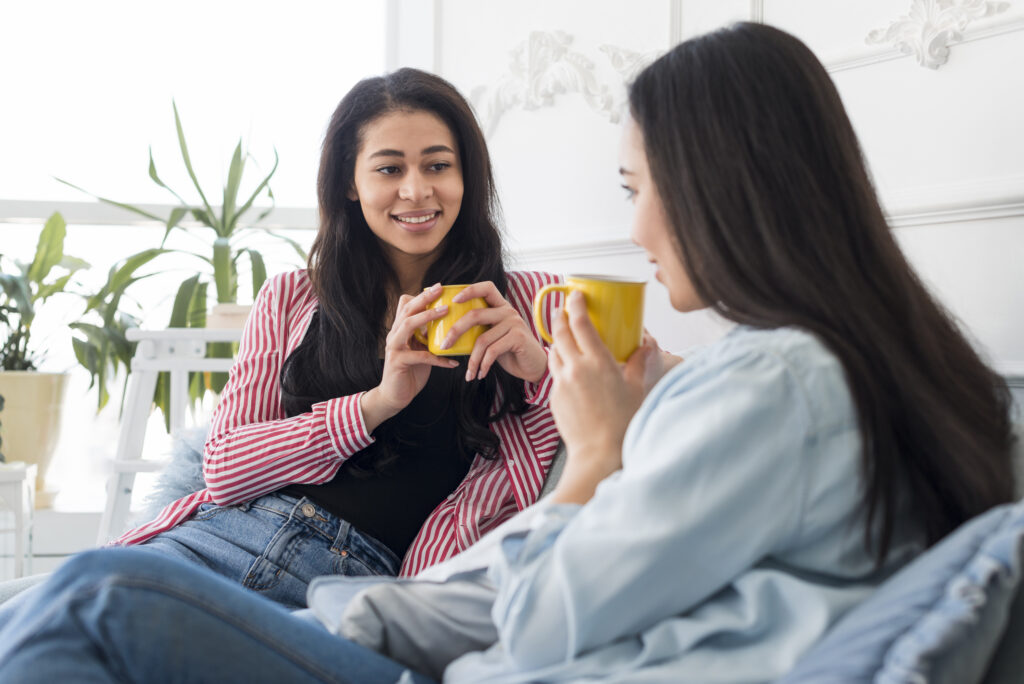 Two girls talking over a cuppa for sad article