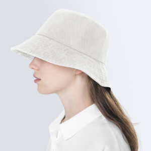 Teenage girl in beige bucket hat to keep safe in the sun