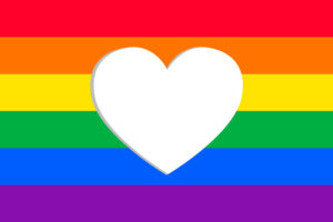 Rainbow flag with heart cut out in middle for coming out article