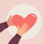 Hands holding heart for Volunteering and Mental Health blog