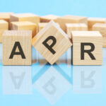 The letters A P and R written on wooden blocks for the Understanding Borrowing blog