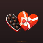 Box of chocolates in heart shape with lid half off for Valentine single blog