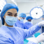 Surgeon looking at medical monitor during surgery