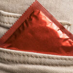 Condom in packet in pocket for contraception blog