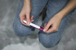 Pregnancy test held in two hands