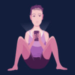 Male sat on floor in shorts and vest on smartphone at night. 