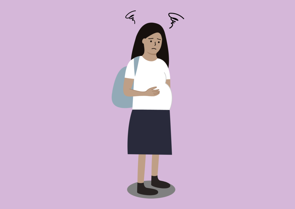 Teenage girl worried due to an unplanned pregnancy. she is wearing a backpack and holding her stomach with her hand.