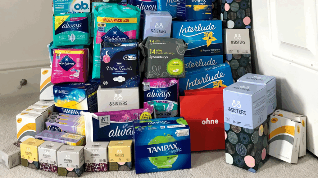 Stack of period products like tampons and pads