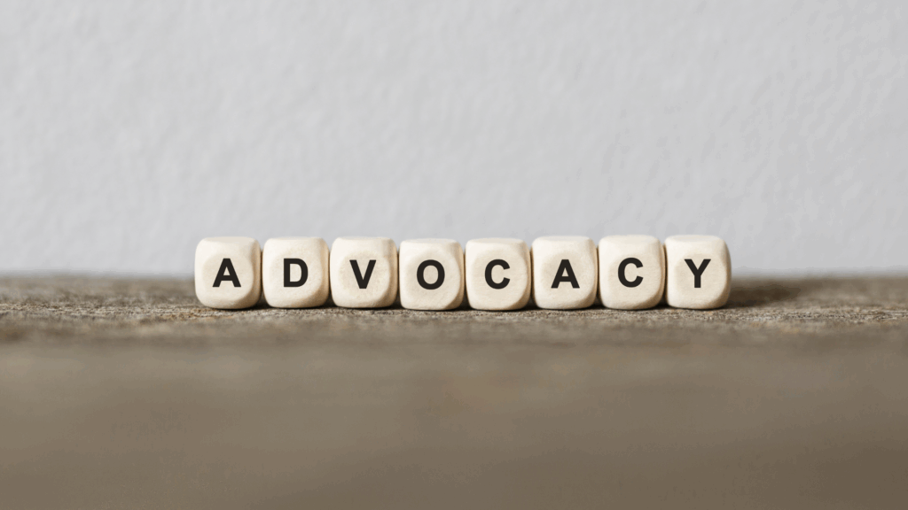 The word advocacy spelt out with beads
