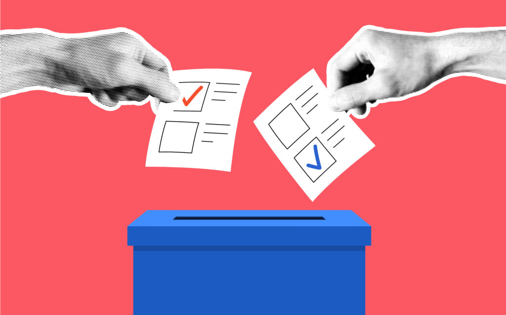 Picture of two people putting their votes into the ballot box